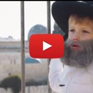 Child playing role of Jewish tour guide in Jerusalem