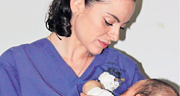 Jewish nurse feeds palestinian baby