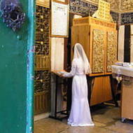 Jewish bride praying at Cave of the Patriarchs before her wedding, 2010