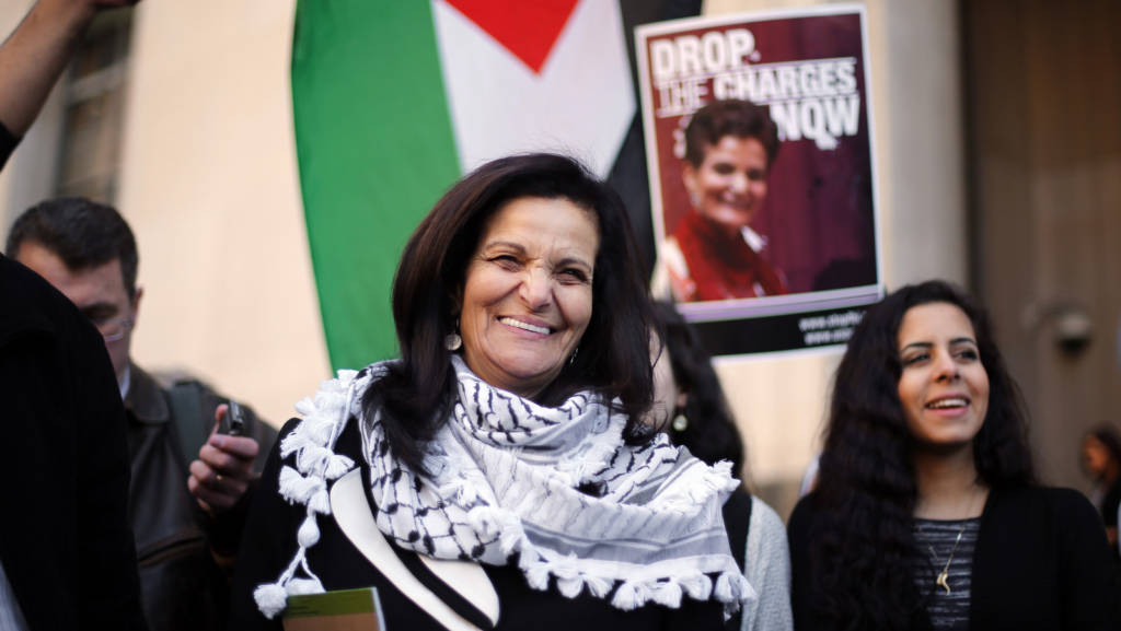 Rasmea Odeh smiles after leaving federal court