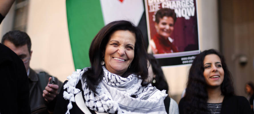 Rasmea Odeh smiles after leaving federal court