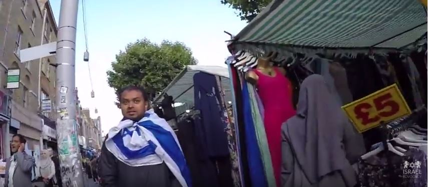 Zionist wears Israeli flag in London