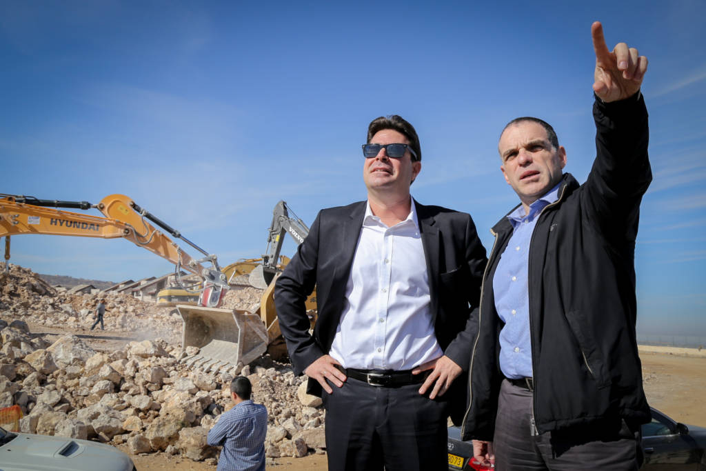 Israeli officials survey a construction site in Efrat earlier in the year (illustrative) (Gershon Elinson/FLASH90)