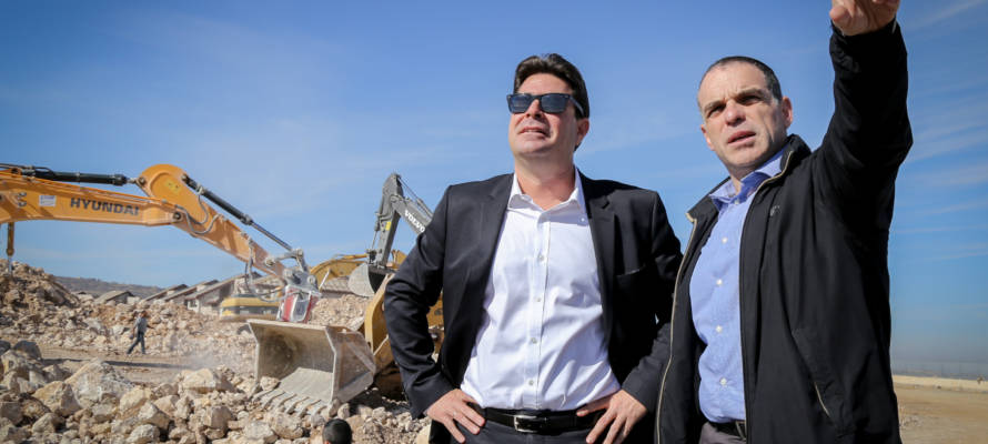 Israeli officials survey a construction site in Efrat earlier in the year (illustrative) (Gershon Elinson/FLASH90)