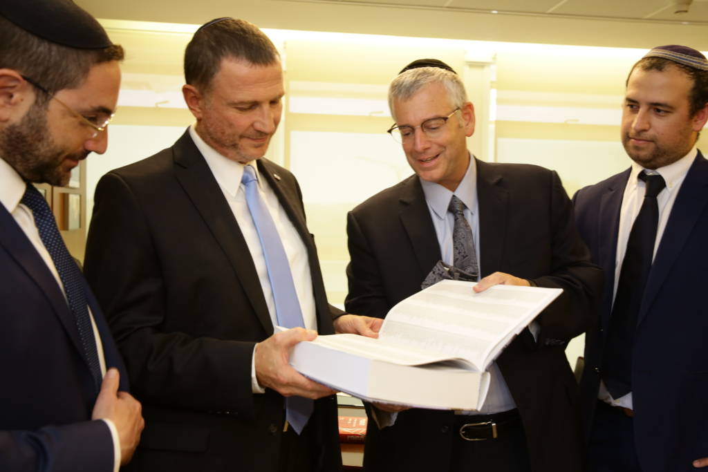 Knesset Speaker Yuli Edelstein and UWi staff display the Jerusalem Declaration