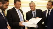 Knesset Speaker Yuli Edelstein and UWi staff display the Jerusalem Declaration