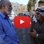 A Palestinian and an Israeli seen talking in Hebron,