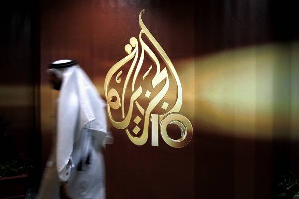 An Al-Jazeera employee in Qatar. (AP Photo/Kamran Jebreili, File)