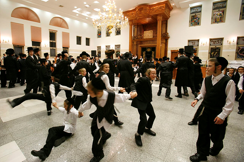 Men and boys dancing on Sukkot
