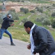 Palestinian rock-throwing terrorists. (illustrative) (Shutterstock)