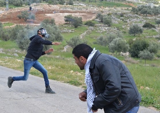 Palestinian rock-throwing terrorists. (illustrative) (Shutterstock)