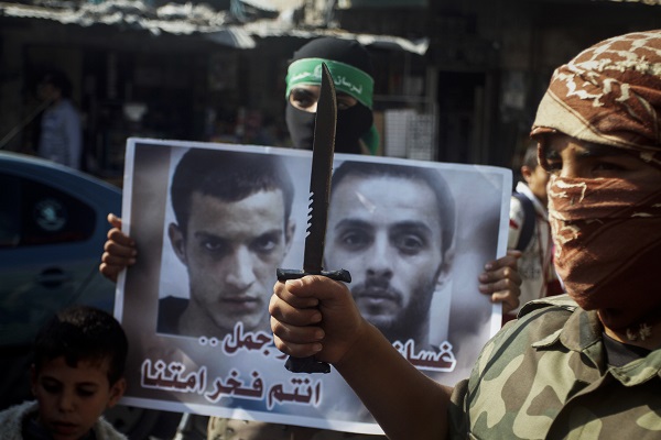 Palestinians celebrate terrorist massacre at a Jerusalem synagogue. (Abed Rahim Khatib/Flash90)