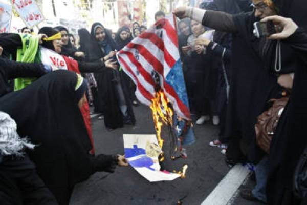 Iranians burn a U.S. flag. (AP Photo/Vahid Salemi, File)