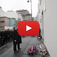 French politicians observe a minute of silence outside Charlie Hebdo's former office. (AP Photo/Christophe Ena, Pool)