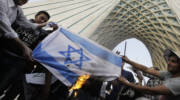 Iranians burn an Israeli flag. (AP Photo/Vahid Salemi)