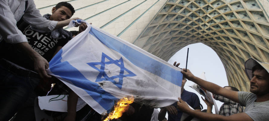 Iranians burn an Israeli flag. (AP Photo/Vahid Salemi)