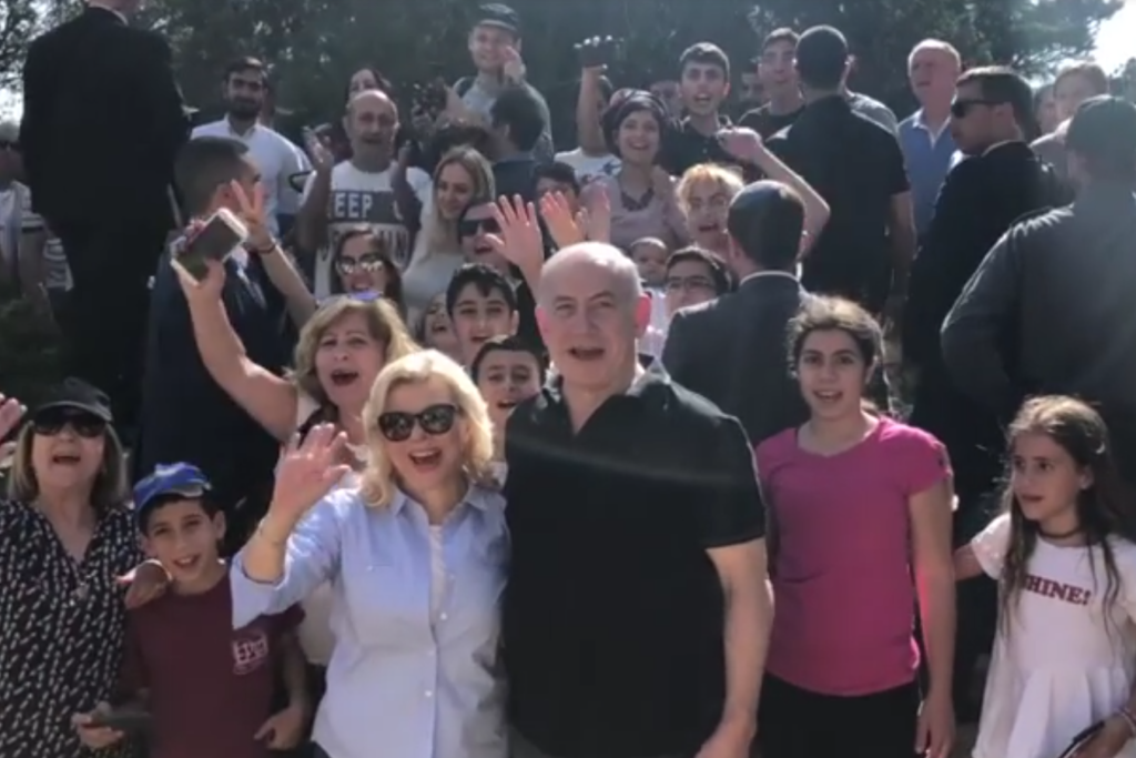 The Israeli prime minister and his wife celebrating Independence Day with other Israelis. (screenshot)