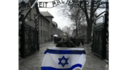 Holding Israeli flag at Auschwitz