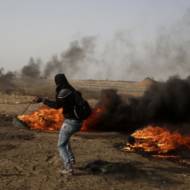 Palestinian rioter on the Gaza fence