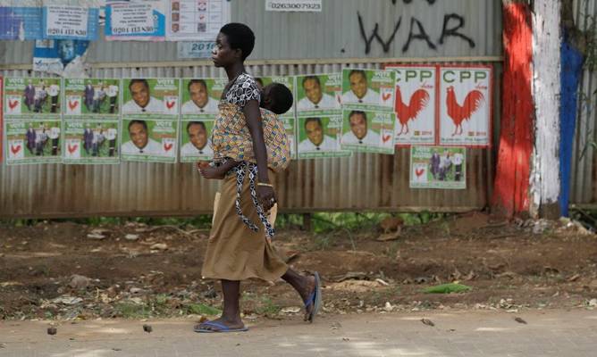 A woman walks on a street in Accra, Ghana