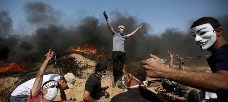 Palestinians setting fires during violent riots in the Gaza Strip. (AP Photo/Adel Hana)