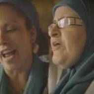 A Jewish woman and Muslim woman sing together. (ScreensAhot)