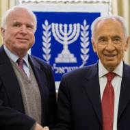 Republican US Senator John McCain (L) shake hands with Israeli President Shimon Peres. (Yonatan Sindel/Flash90)