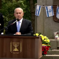 At a memorial ceremony to remember the Jews slain in the Netanyahu speaks at a memorial in Lithuania.  (screenshot)