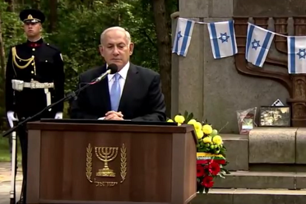 At a memorial ceremony to remember the Jews slain in the Netanyahu speaks at a memorial in Lithuania.  (screenshot)