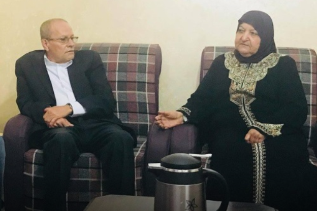 Palestinian Prisoners’ Affairs Director Qadri Abu Bakr (L) with the mother of multiple terrorists Um Yusuf Abu Hmeid. (PMW)