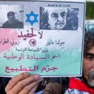 A an anti-Israel Tunisian protester at the office of the nation's only Jewish cabinet member. (AP Photo/Hassene Dridi)
