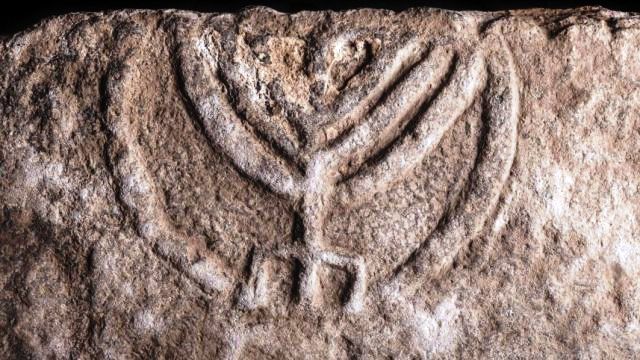 The seven-branched menorah on a large stone slab found in Tiberias. (Tal Rogovski)
