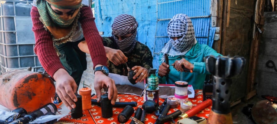 Palestinian prepare explosives with which to try to kill Israelis on the Gaza border. (Abed Rahim Khatib/Flash90)