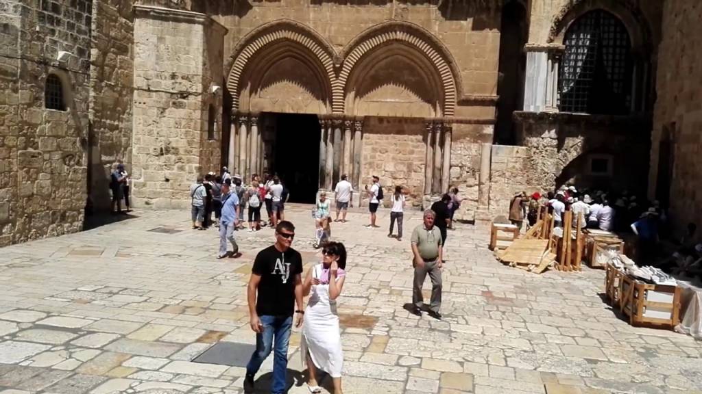 Tourists visit Church of the Holy Sepulchre in Jerusalem's Old City.