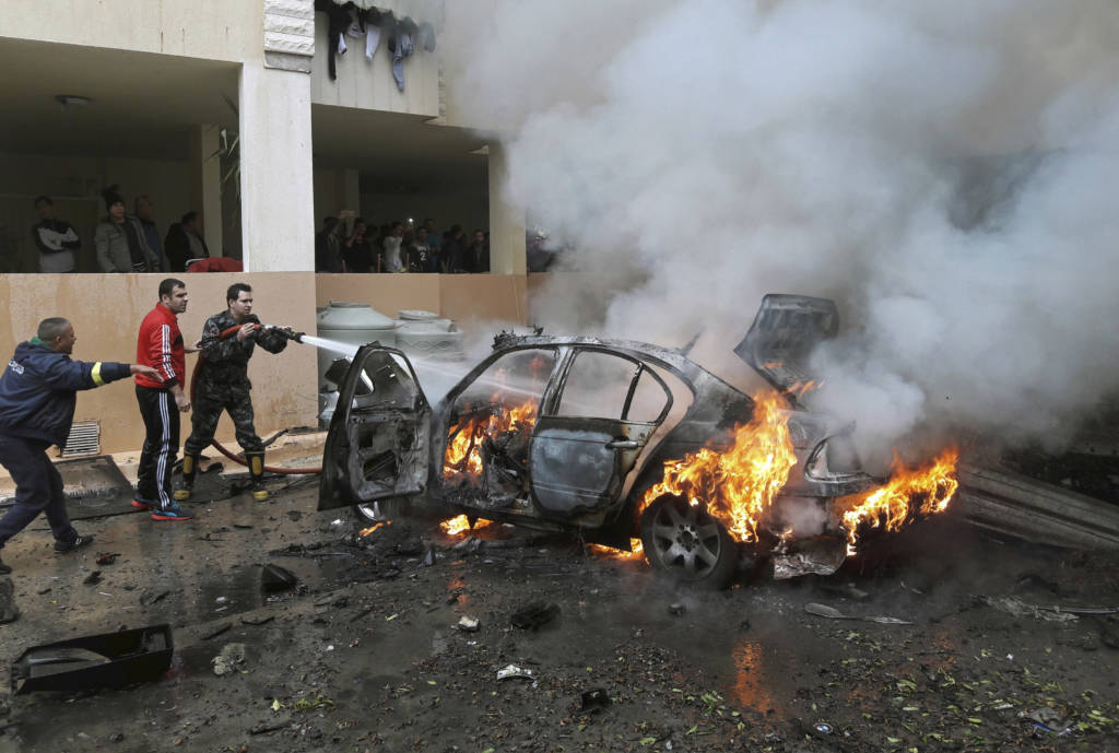 A Palestinian's burning car blown up in Lebanon. (AP Photo/Mohammed Zaatari)
