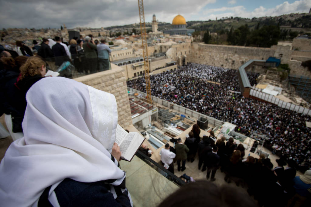 Worshipers pray in front of the Western Wall. (Yonatan Sindel/Flash90)