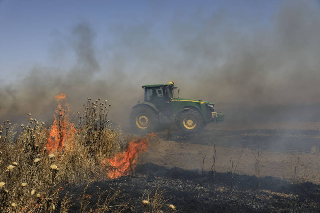 A fire started in Israel by terrorists in the Gaza Strip. (AP Photo/Tsafrir Abayov)