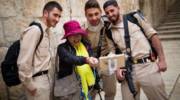 A tourist seen taking selfies with soldiers in Jerusalem's Old City. (Corinna Kern/FLASH90)