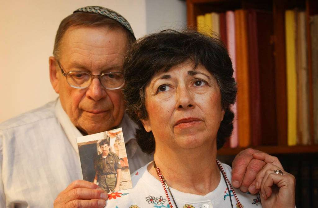 Miriam and Yoni Baumel hold a picture of their son Zachary Baumel, who went missing in at the Battle of Sultan Yacub in 1982. (Flash90)