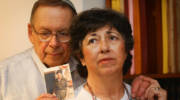 Miriam and Yoni Baumel hold a picture of their son Zachary Baumel, who went missing in at the Battle of Sultan Yacub in 1982. (Flash90)