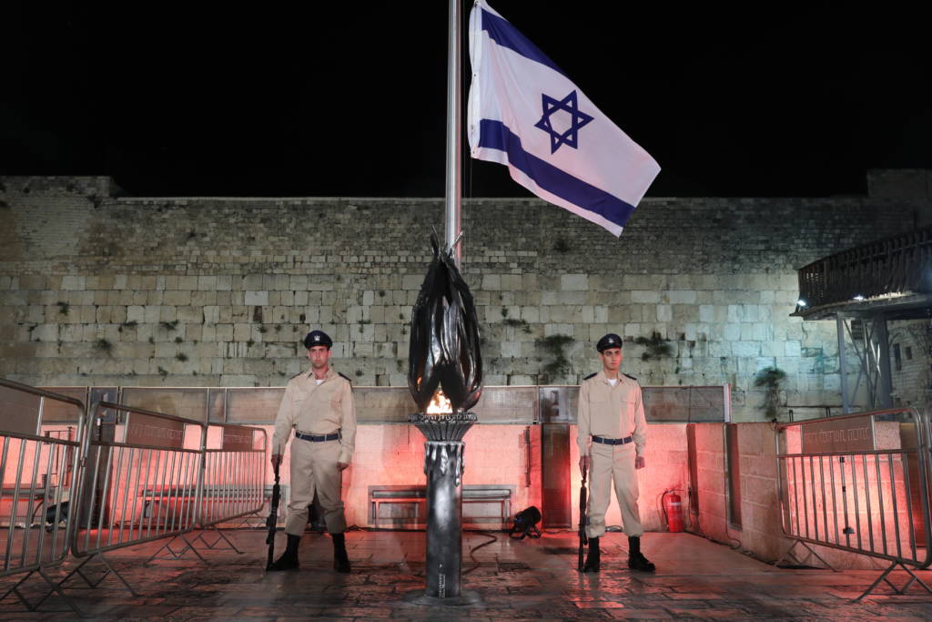 Israeli soldiers stand at attention during the ceremony marking Remembrance Day for Israel's fallen soldiers and victims of terror. (Noam Revkin Fenton/Flash90)