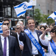 New York Gov. Andrew Cuomo, center, and Consul General of Israel in New York Dani Dayan. (AP Photo/Craig Ruttle)