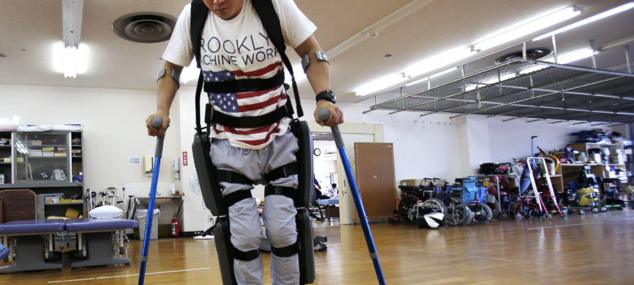 Yuichi Imahata walks using a robotic exoskeleton called ReWalk in Tokyo. (AP Photo/Shuji Kajiyama)