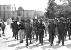 Defense Minister Moshe Dayan, Chief of staff Yitzhak Rabin, Gen. Rehavam Zeevi (R) And Gen. Narkis in the old city of Jerusalem, 1967. (Flickr - Government Press Office)