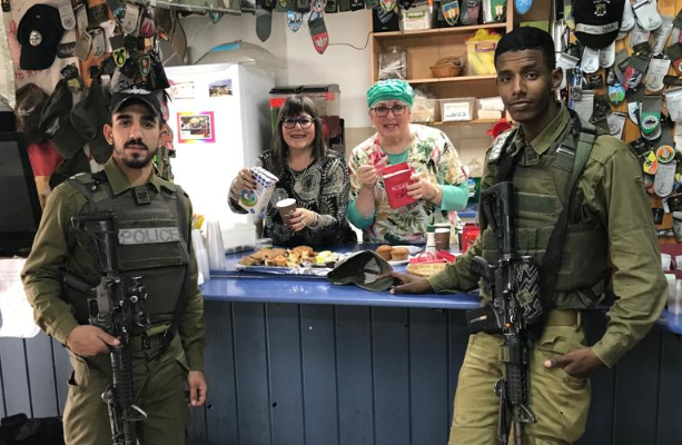 Ginny Nissenbaum and Sharon Katz serve soldiers at Pina Chama (Courtesy)