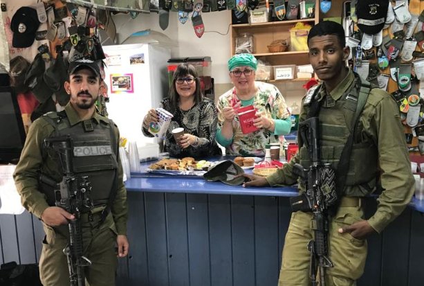 Ginny Nissenbaum and Sharon Katz serve soldiers at Pina Chama (Courtesy)