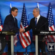 US Energy Secretary Rick Perry, left, shakes hands with Prime Minister Benjamin Netanyahu.