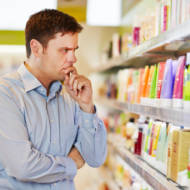 Pensive man at supermarket