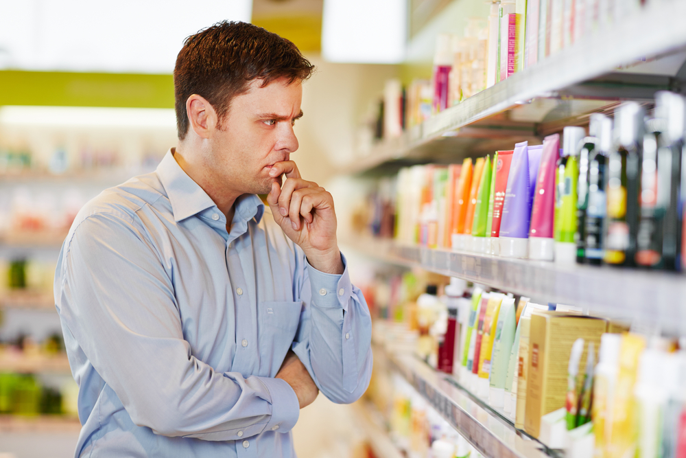 Pensive man at supermarket