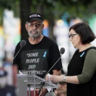 Nic Haros, left, participates in the ceremony marking the 18th anniversary of the attacks of Sept. 11, 2001 at the National September 11 Memorial, Wednesday, Sept. 11, 2019 in New York